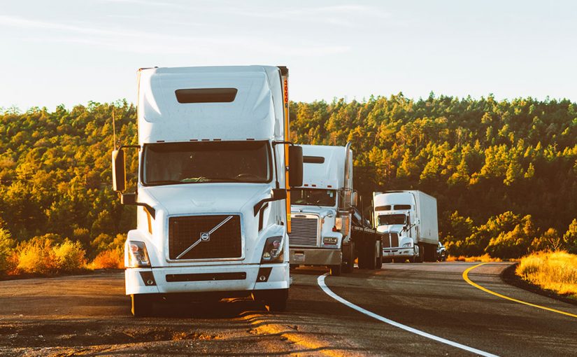 white-volvo-semi-truck-on-side-of-road-2199293-825x510