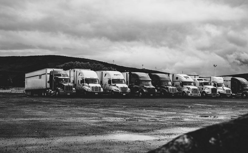 parked-trucks-under-clouds-2348359-825x510